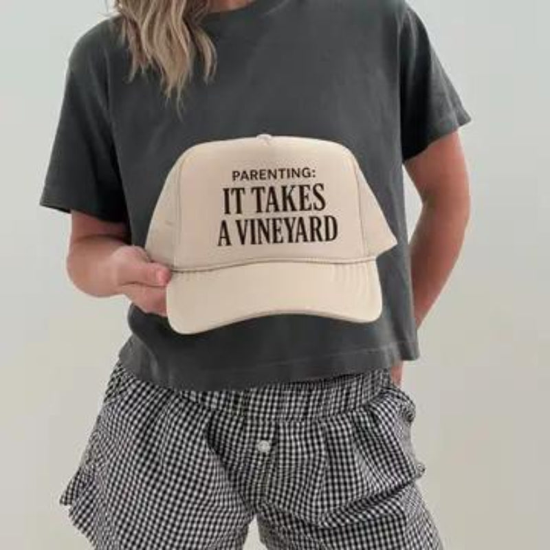 Hey Jude Graphic Tees Parenting: It Takes a Vineyard Trucker Hat | Funny Mom Life | Tan